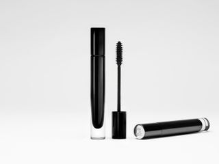 Black mascara encased in a recycled glass container