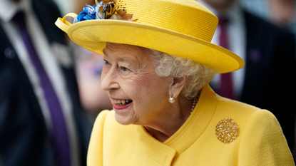 Britain's Queen Elizabeth II reacts during her visit to Paddington Station in London on May 17, 2022, to mark the completion of London's Crossrail project, ahead of the opening of the new 'Elizabeth Line' rail service next week