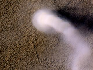 NASA's Mars Reconnaissance Orbiter snapped a photo of a 12-mile-high dust devil on the Red Planet.