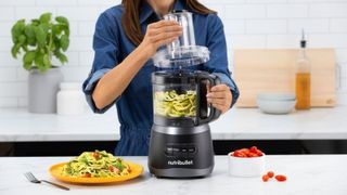 Best food processor - the nutribullet on a countertop with courgette inside