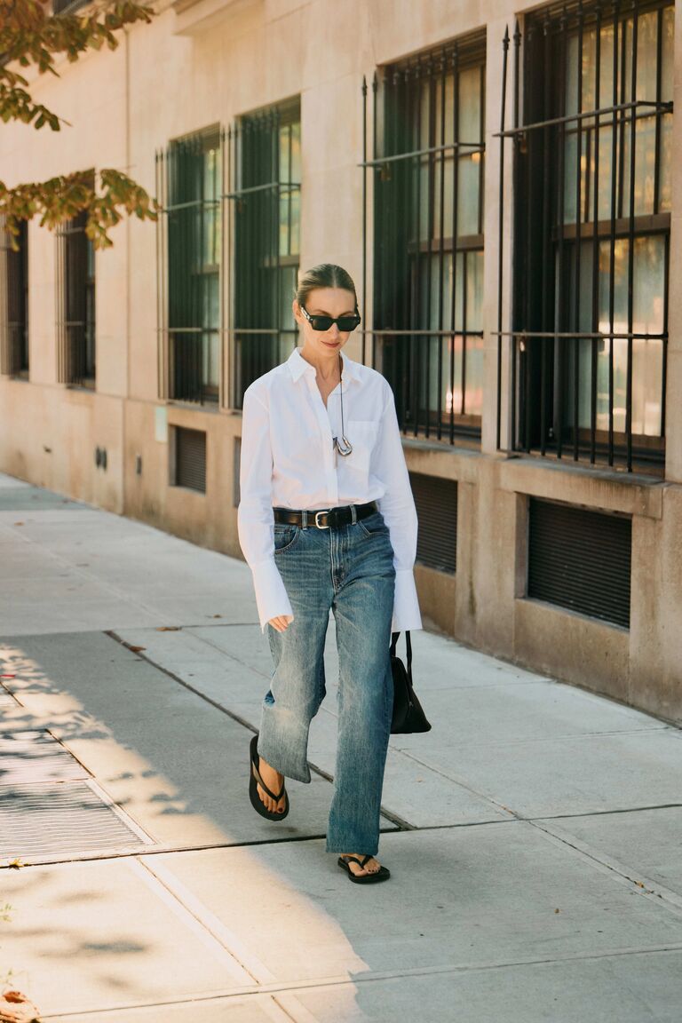 New York Fashion Week show goers wear jeans with belts.