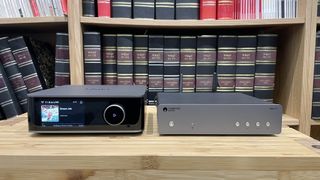 WiiM Ultra and Cambridge Audio MXN10 placed side by side on a wooden rack