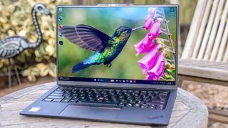 Lenovo ThinkPad X1 Carbon Gen 13 Aura Edition on a garden table