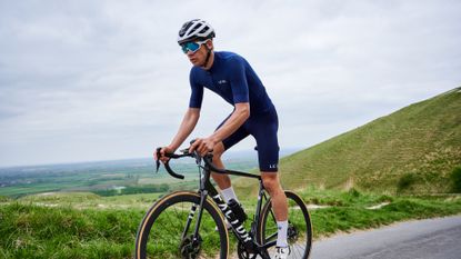 Male rider who is cycling with knee pain