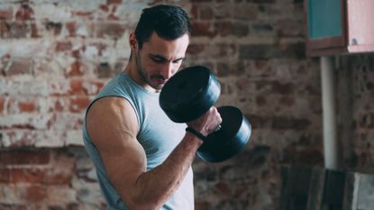 Man performing biceps curls