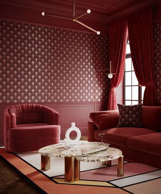 living room with red and gold art deco style wallpaper, red curtains, burgundy dark red walls and ceiling, marble and gold coffee table nest, graphic rug, red armchair and couch, brass retro lights