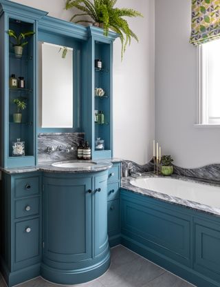 Blue bathroom with white tiled walls