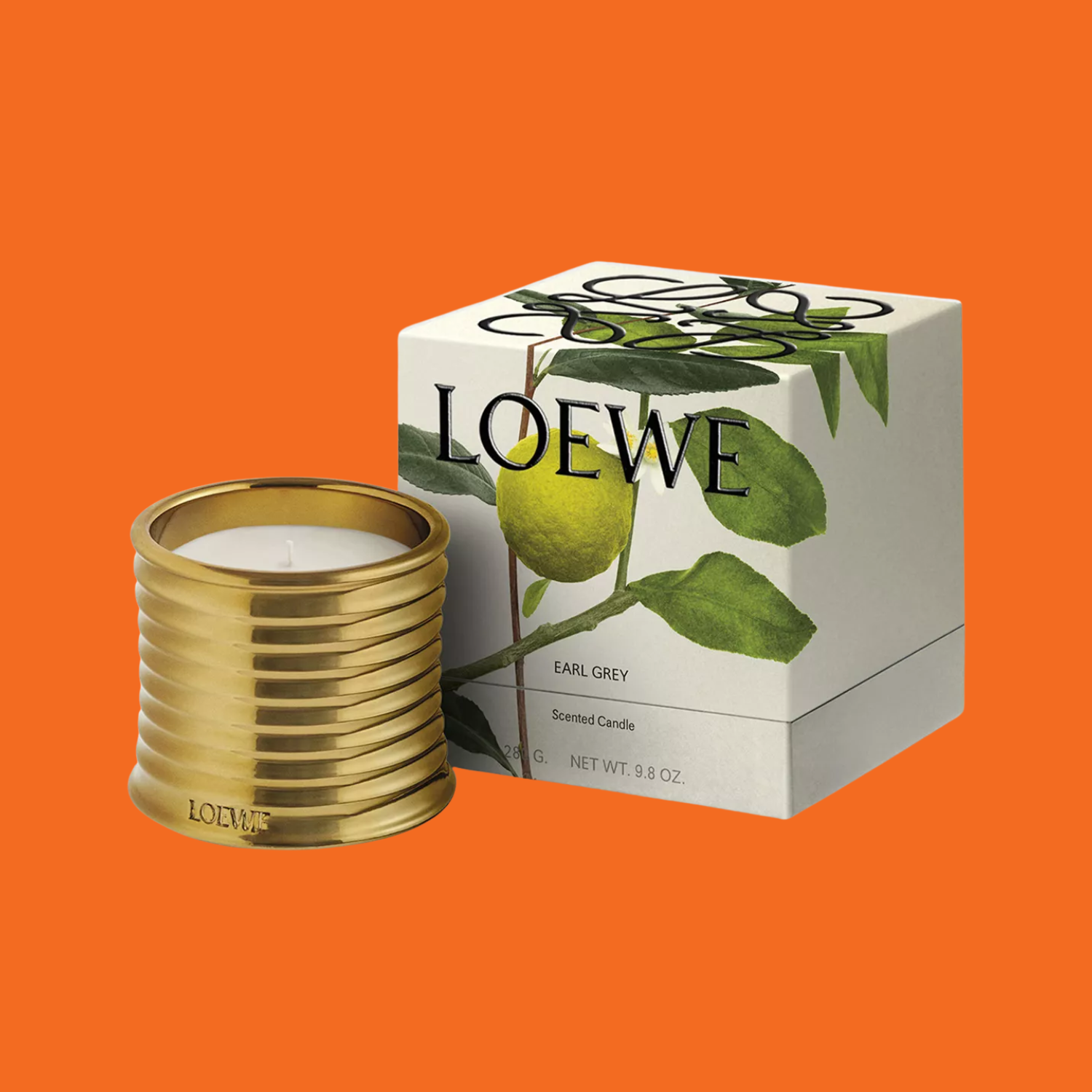 A gold candle beside a box