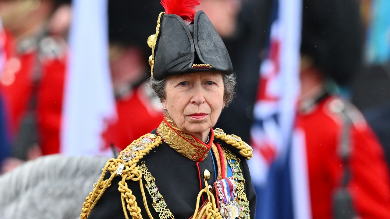 Princess Anne, Princess Royal rides on horseback behind the gold state coach on coronation day 2023