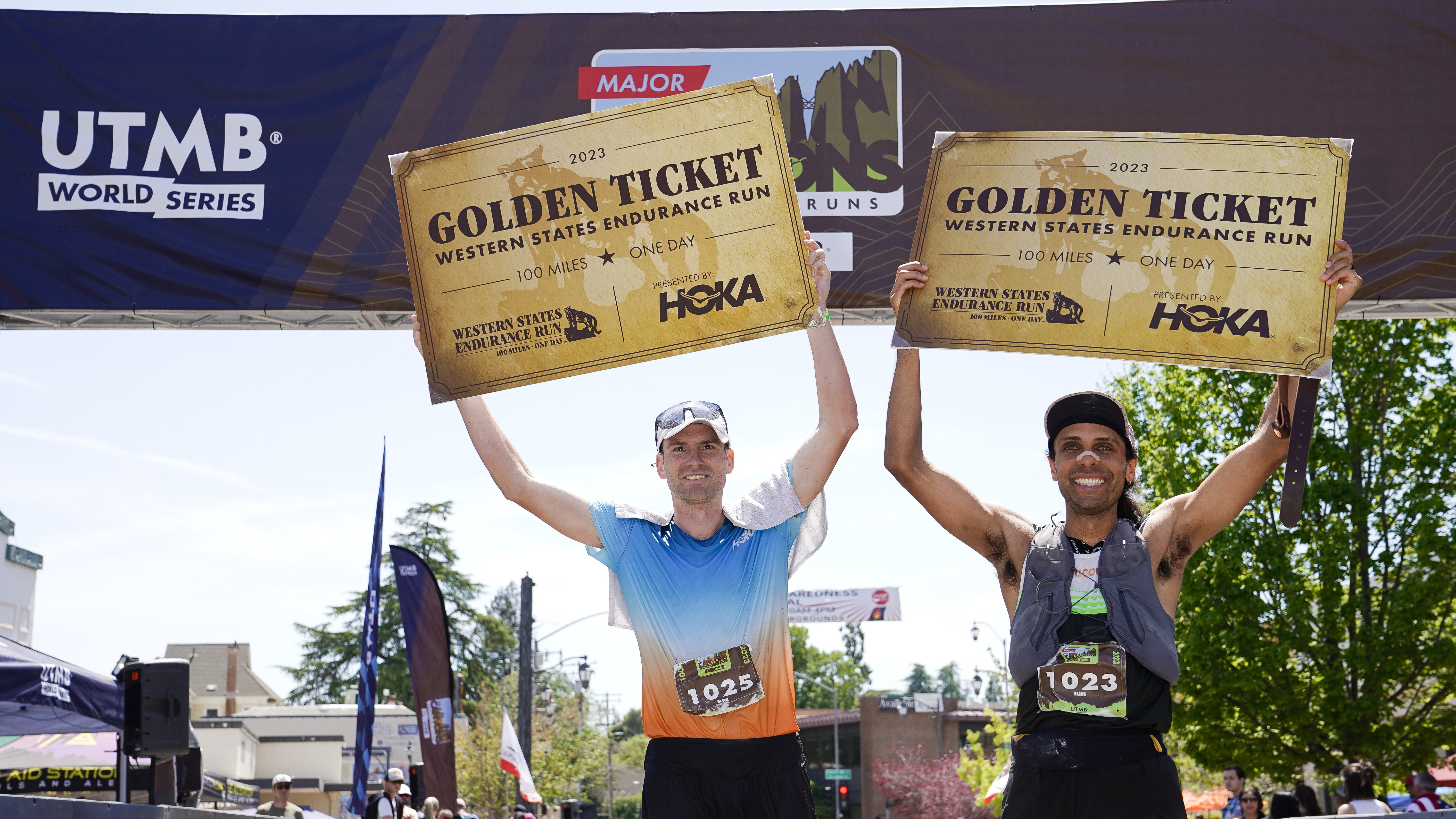 Cole Watson of the United States (L) and Adam Merry of the United States celebrate with their 2023 HOKA Golden Tickets for the Western States Endurance Run