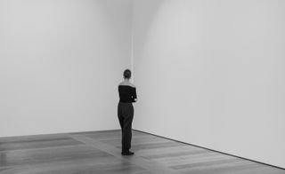 black and white pictures of people looking at white walls