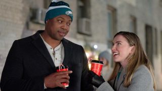 Ser'Darius Blain and Sara Canning in Christmas On Call.