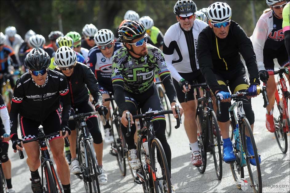 A group of fans ride with Peter Sagan