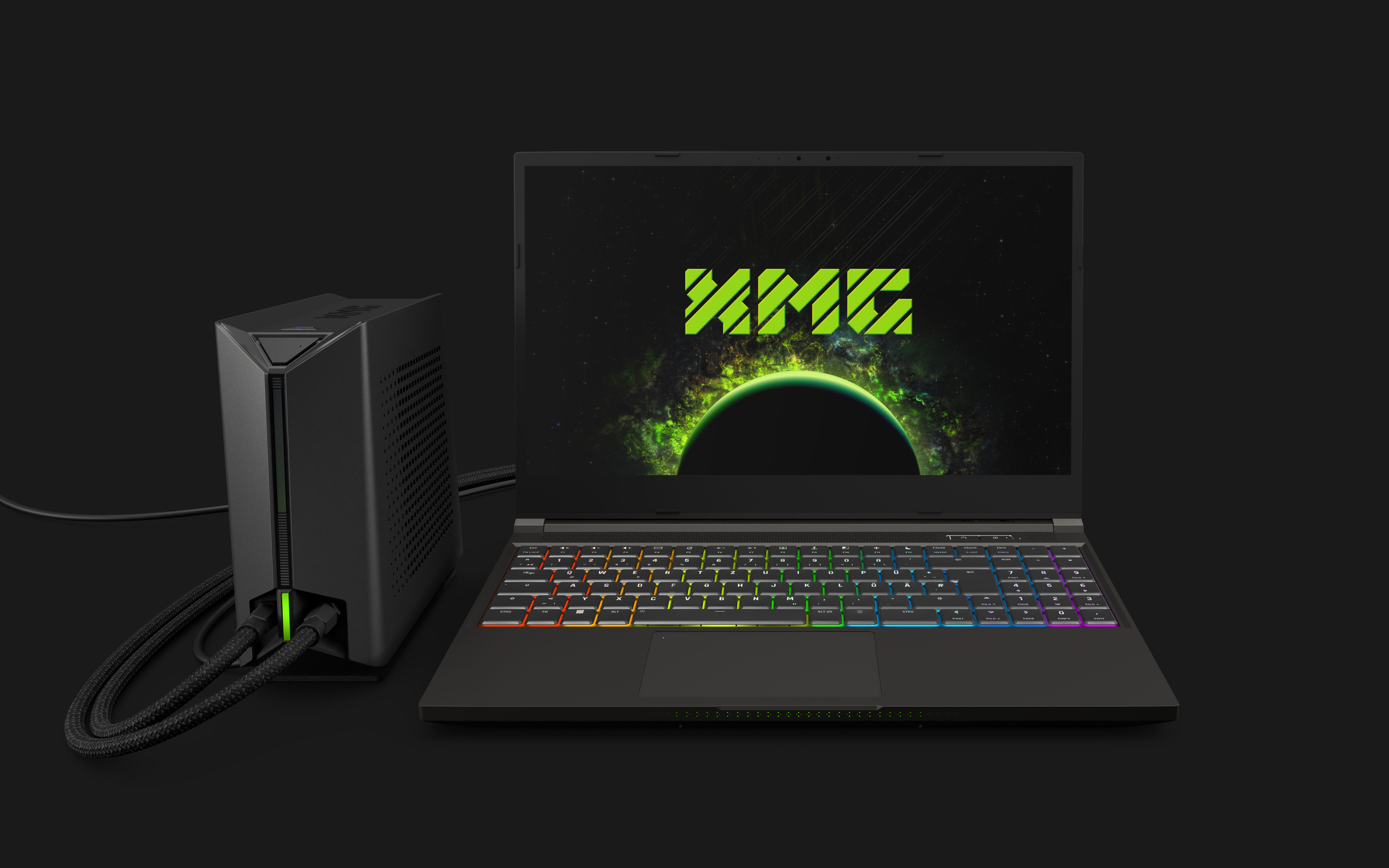The XMG Neo 15 laptop hooked up to the XMG Oasis liquid cooling system
