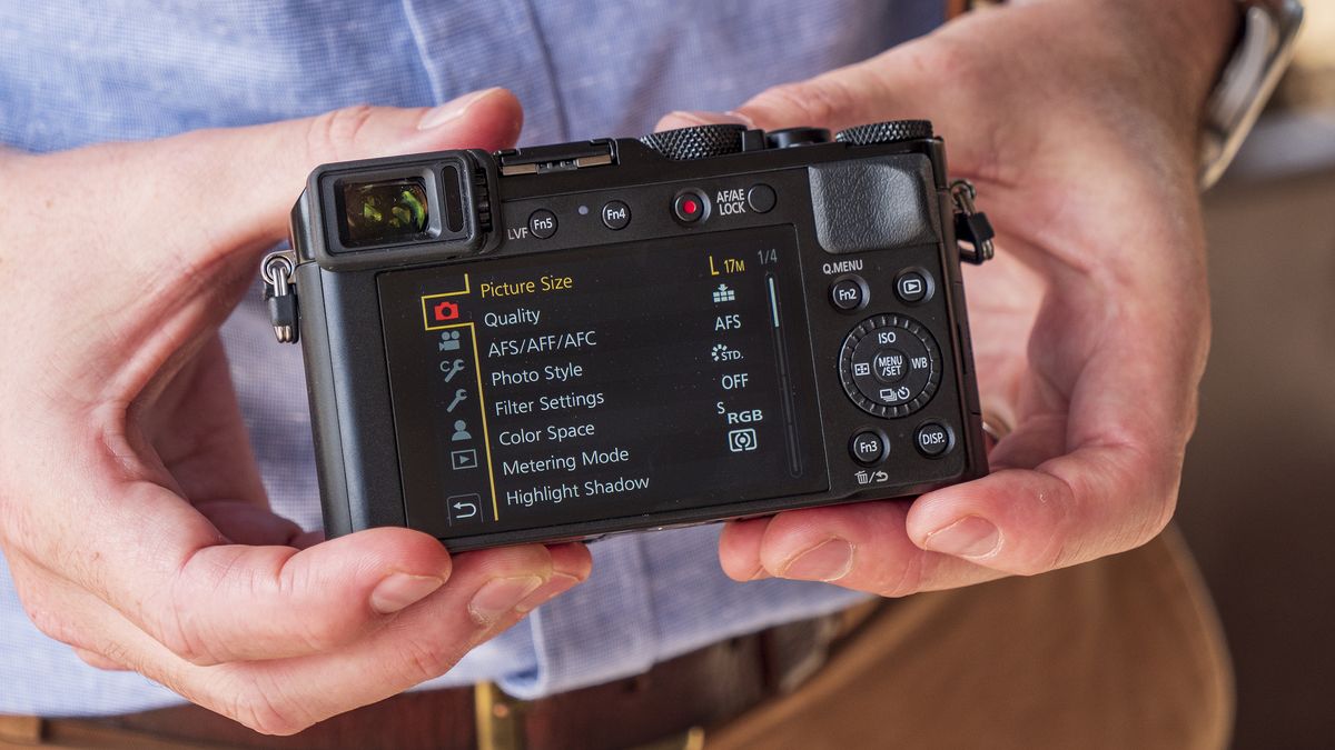 Panasonic Lumix LX100 II compact camera in the hand