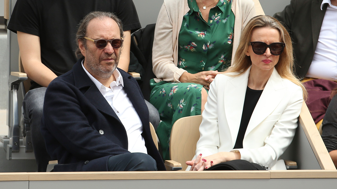 Xavier Niel and Delphine Arnault in stands during French Tennis