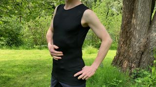 man wearing sleeveless base layer outside