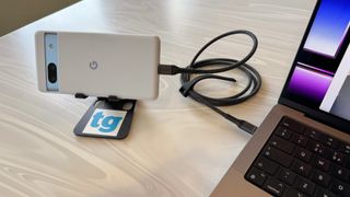 A Pixel 7a connected to a MacBook via USB-C cable