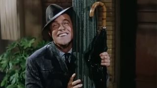 Gene Kelly dances with a lamppost in famous scene from Singin' In The Rain.