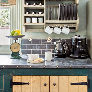 Navy blue kitchen with kettle and toaster