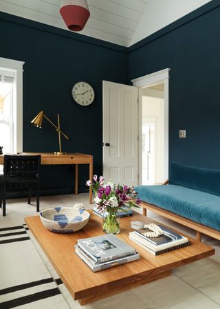 Blue bedroom with wooden furniture