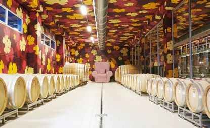 L’Astemia Pentita cellar with oversized Studio 65 Mickey armchair