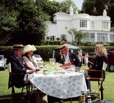 Spectators having lunch in the car park at Henley Royal Regatta. Credit: Alamy