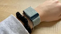 A photo of the Whoop 4.0 with a blue band on the wrist 