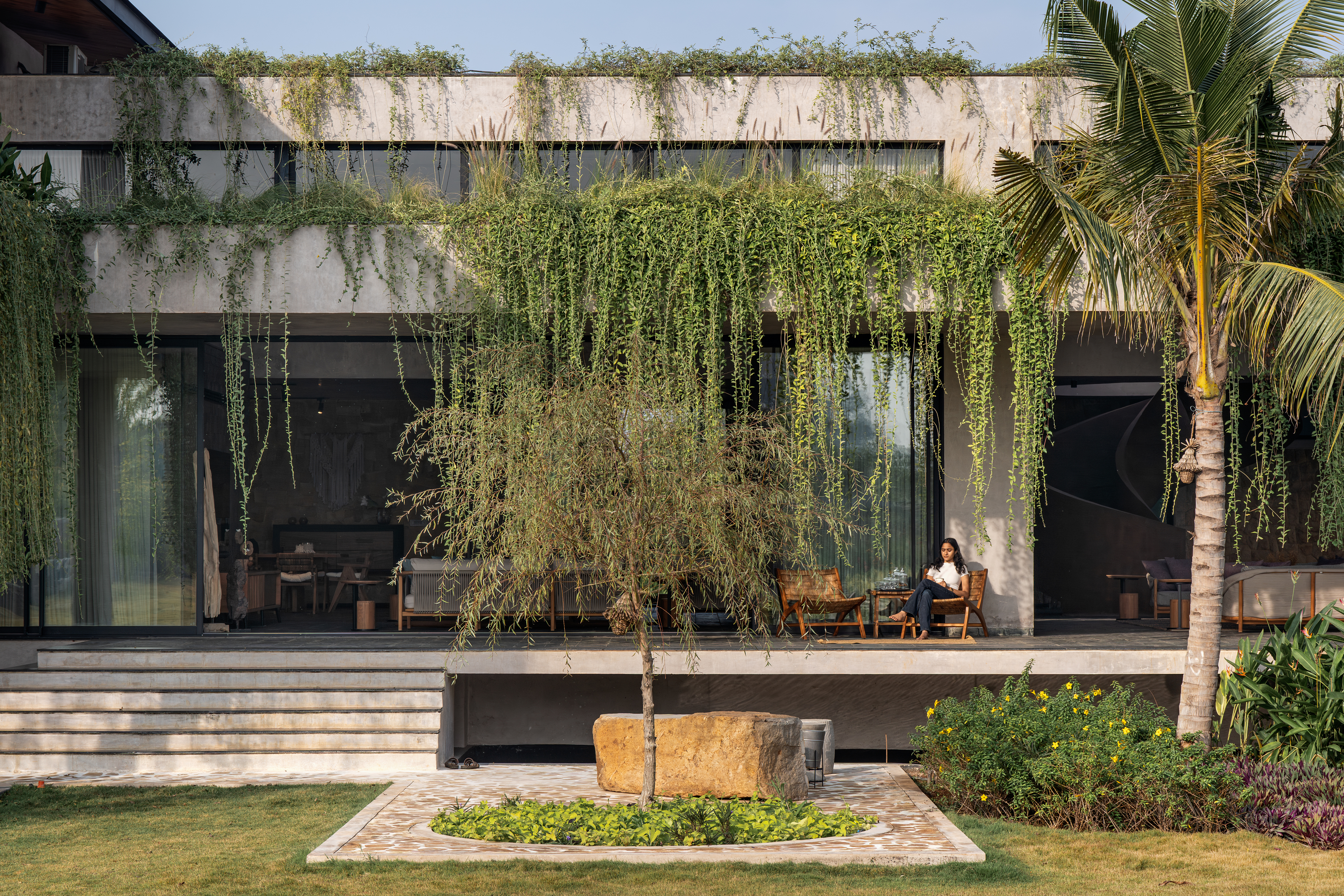 hyderabad home in brutalist style covered in greenery by 23 Degrees Design Shift