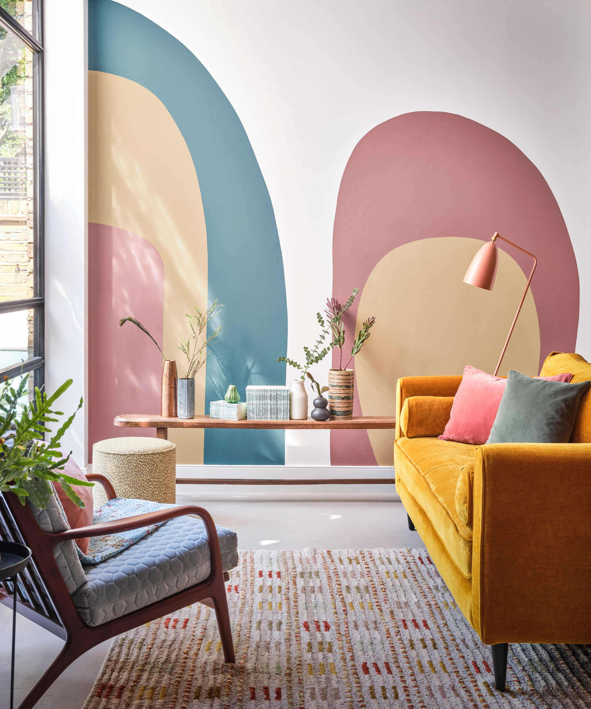 living room with coloured arches painted on walls