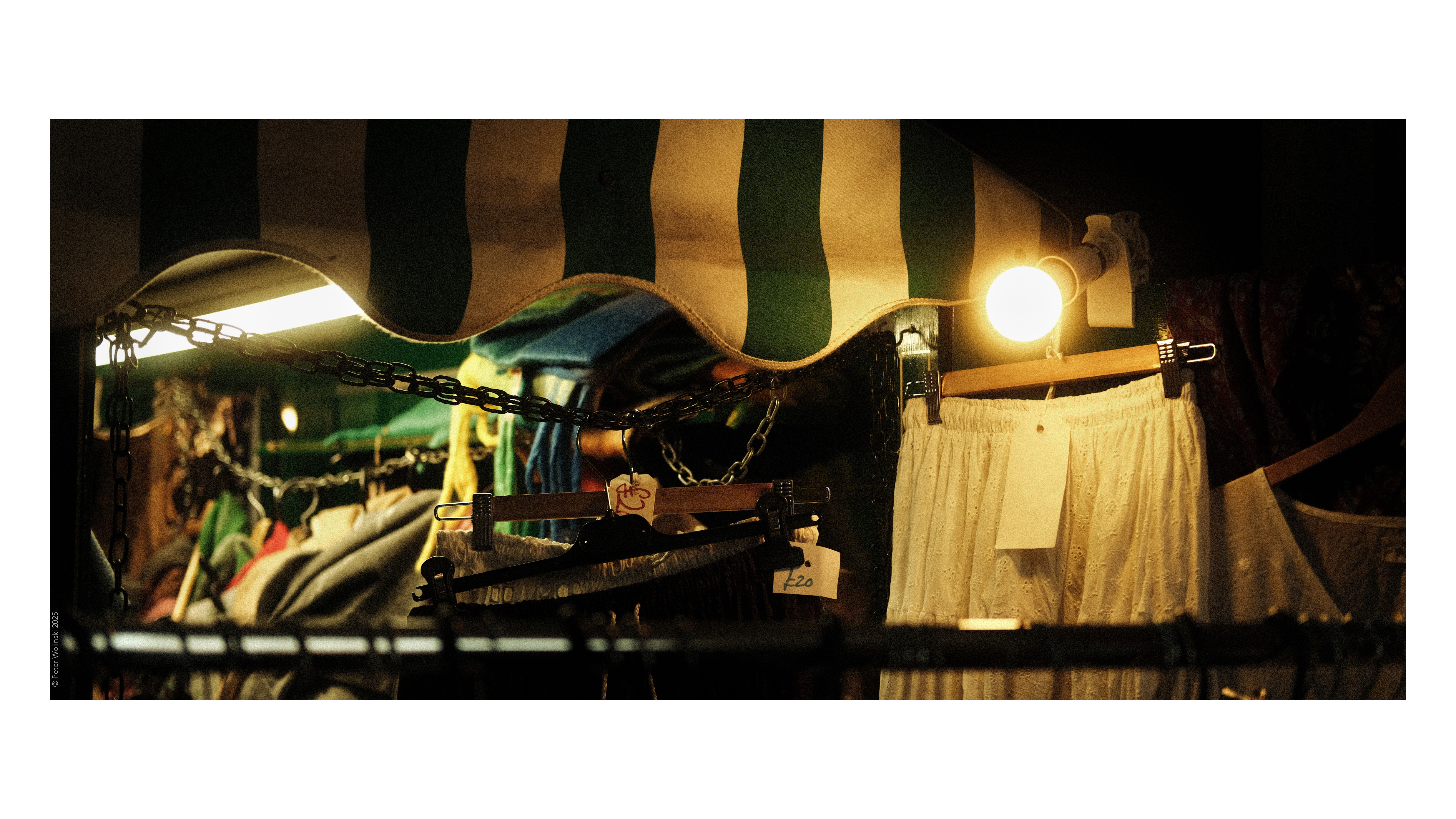 A photo of a market stall, illuminated by a bright light bulb, shot on the Fujifilm X-E4