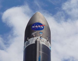 A Rocket Lab Electron booster is decked out with a big NASA logo ahead of the company's first launch for the U.S. space agency from its New Zealand launch site, on the North Island's Mahia Peninsula. Liftoff is scheduled for Dec. 12, 2018.