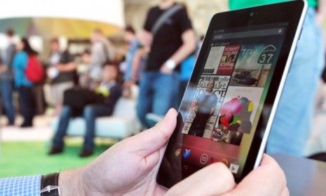 An attendee of Google&amp;#039;s Developers Conference uses the new Nexus 7 tablet, which is expected to retail for $199.