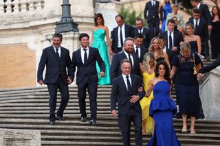 Viktor Hovland and Jose Maria Olazabal hold hands prior to the 2023 Ryder Cup gala