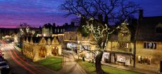 Market Hall and Cotswold stone cottages along High Street at dusk, Chipping Campden, Cotswolds, Gloucestershire