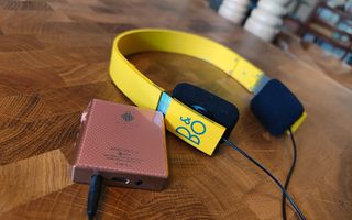 Yellow Form 2 headphones on table