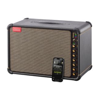 A Positive Grid Spark Live guitar amplifier with smartphone