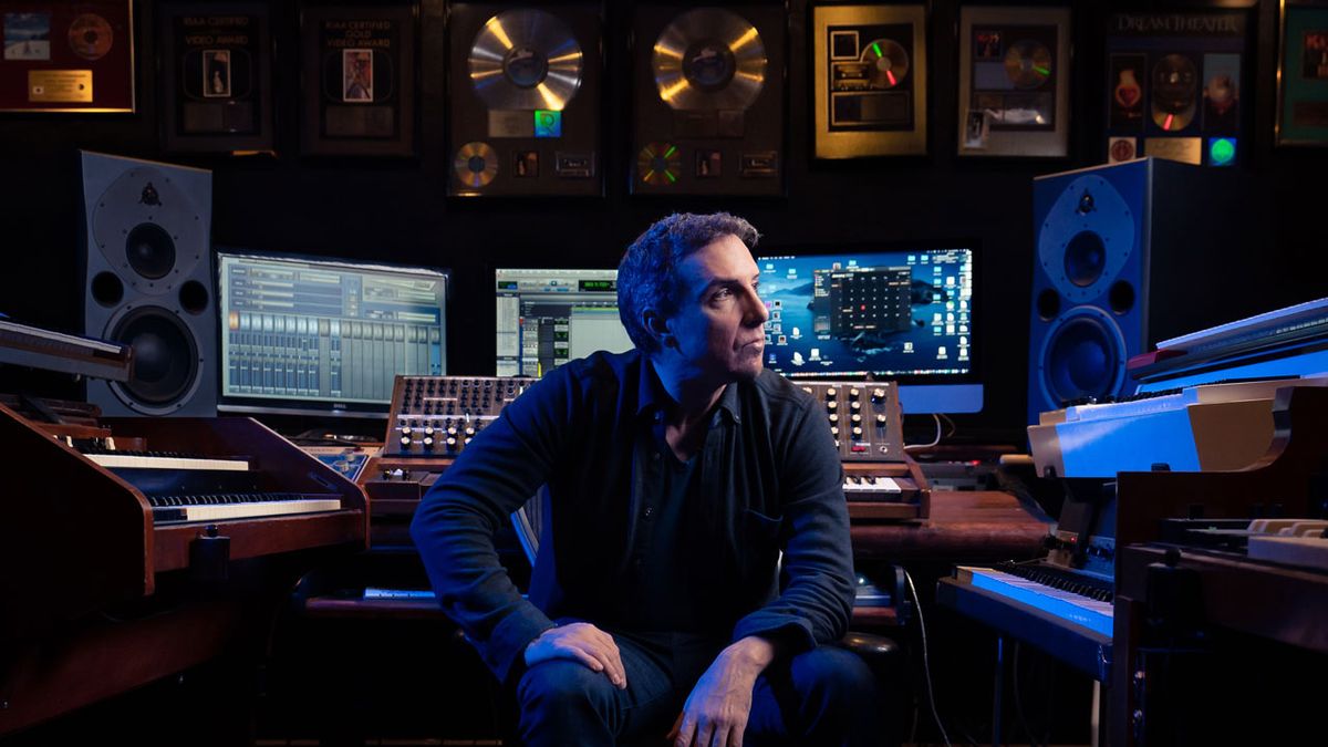 Derek Sherinian studio shot with Gold discs