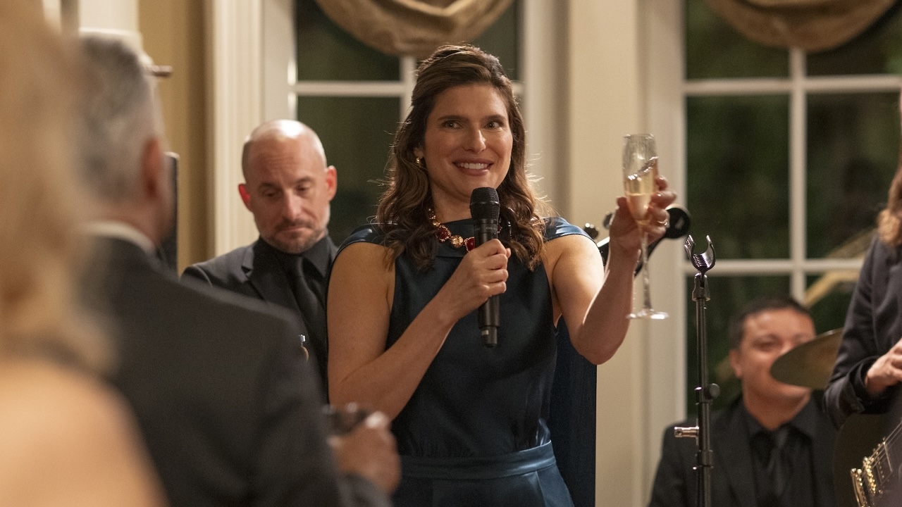 barb holding up champagne giving toast in The Chair Company