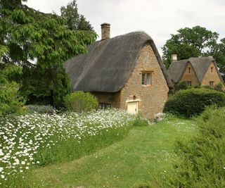 A thatched roof cottage in the costwolds