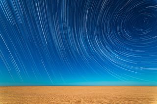 Star Trails on the Beach by Sebastián Guillermaz