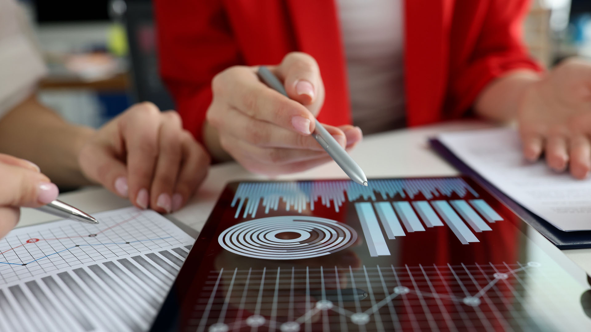 woman viewing data on a tablet