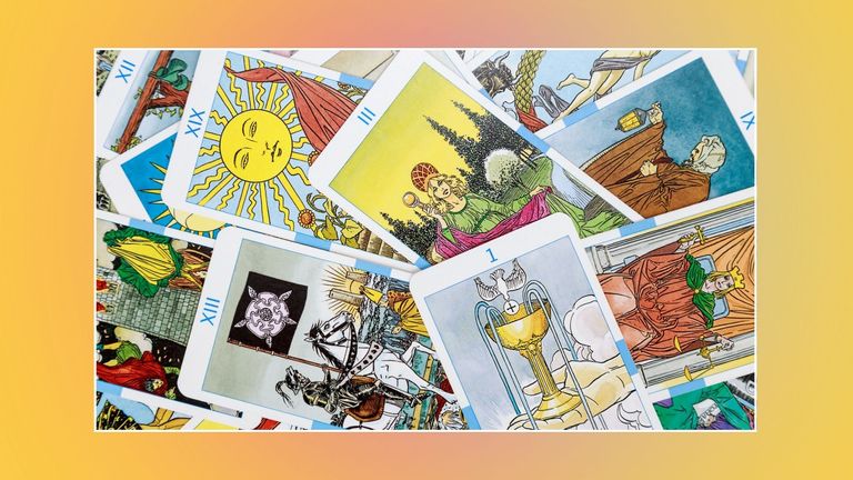 deck of tarot cards on a yellow background