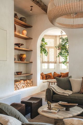 natural boho living room with bookshelf built into an alcove