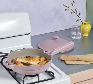 lilac always pan on a stove cooking grilled chicken