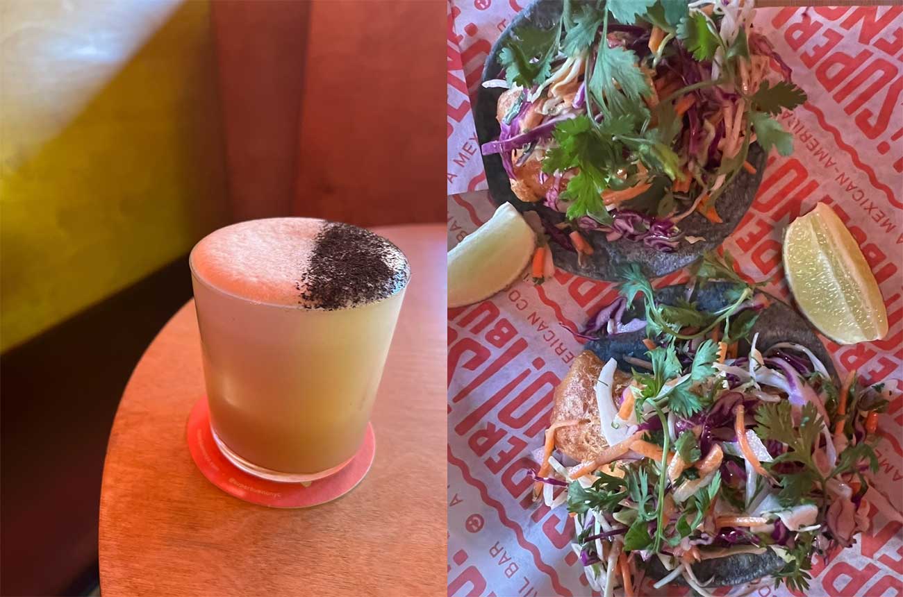 Cocktail and tacos on table