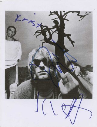 A Nirvana promotional photo signed by the band