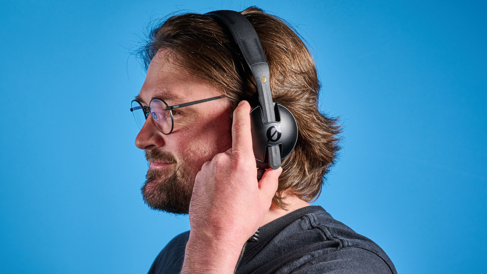 the rode nth-50 studio headphones in black showing the long cable, 3.5mm jack, 1/4 jack, and in use
