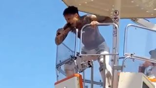 Fever 333 singer Jason Aalon Butler sings from a Ferris wheel at Rock im Park, Germany in June 2023