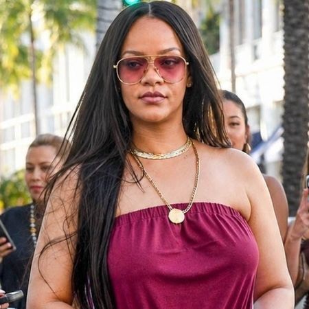 Rihanna styled a strapless sporty jumpsuit with track pant-inspired stripes up each side
